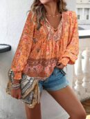 Blusa Floral con Lazada al Cuello y Mangas Farol