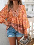 Blusa Floral con Lazada al Cuello y Mangas Farol