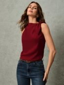 Blusa Negra Asimétrica con Nudo en Hombro y Cuello