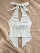 Camisola Negro Elegante con Hebilla Metálica y Dobladillo Asimétrico