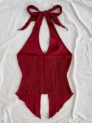 Camisola Negro Elegante con Hebilla Metálica y Dobladillo Asimétrico