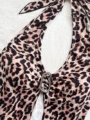 Camisola Negro Elegante con Hebilla Metálica y Dobladillo Asimétrico