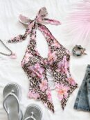 Camisola Negro Elegante con Hebilla Metálica y Dobladillo Asimétrico