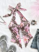 Camisola Negro Elegante con Hebilla Metálica y Dobladillo Asimétrico