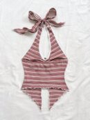 Camisola Negro Elegante con Hebilla Metálica y Dobladillo Asimétrico